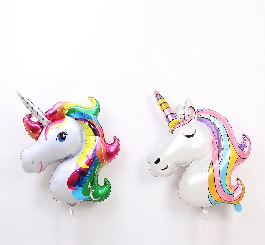 Unicorn head foil balloon rainbow and pastel mane