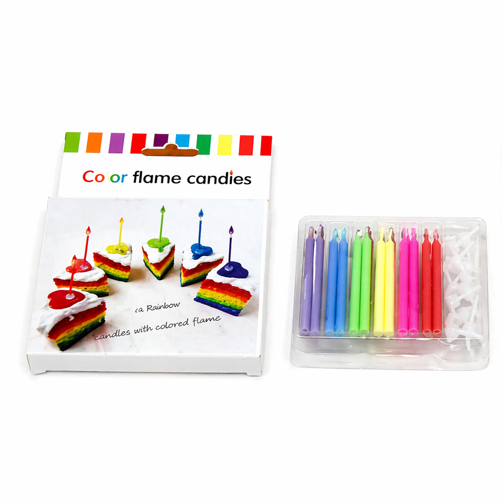 Set of colorful birthday candles with rainbow flames in packaging on a white background
